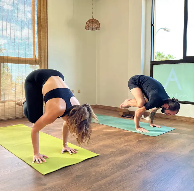 Practicing Bakasana pose.